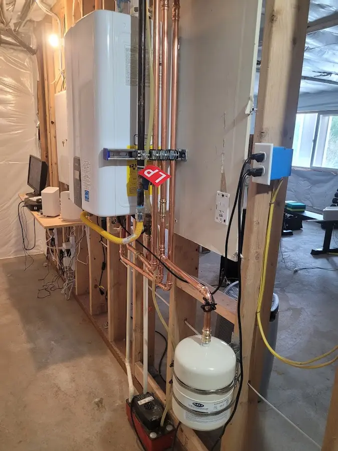 Licensed plumber repairing a kitchen sink in College Park